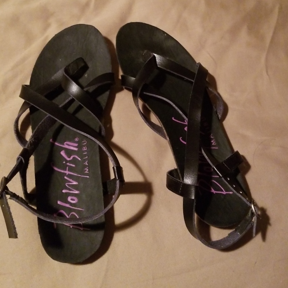 Black soft soled between the toe sandal